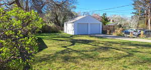 Back yard is fully fenced with dog run behind garage