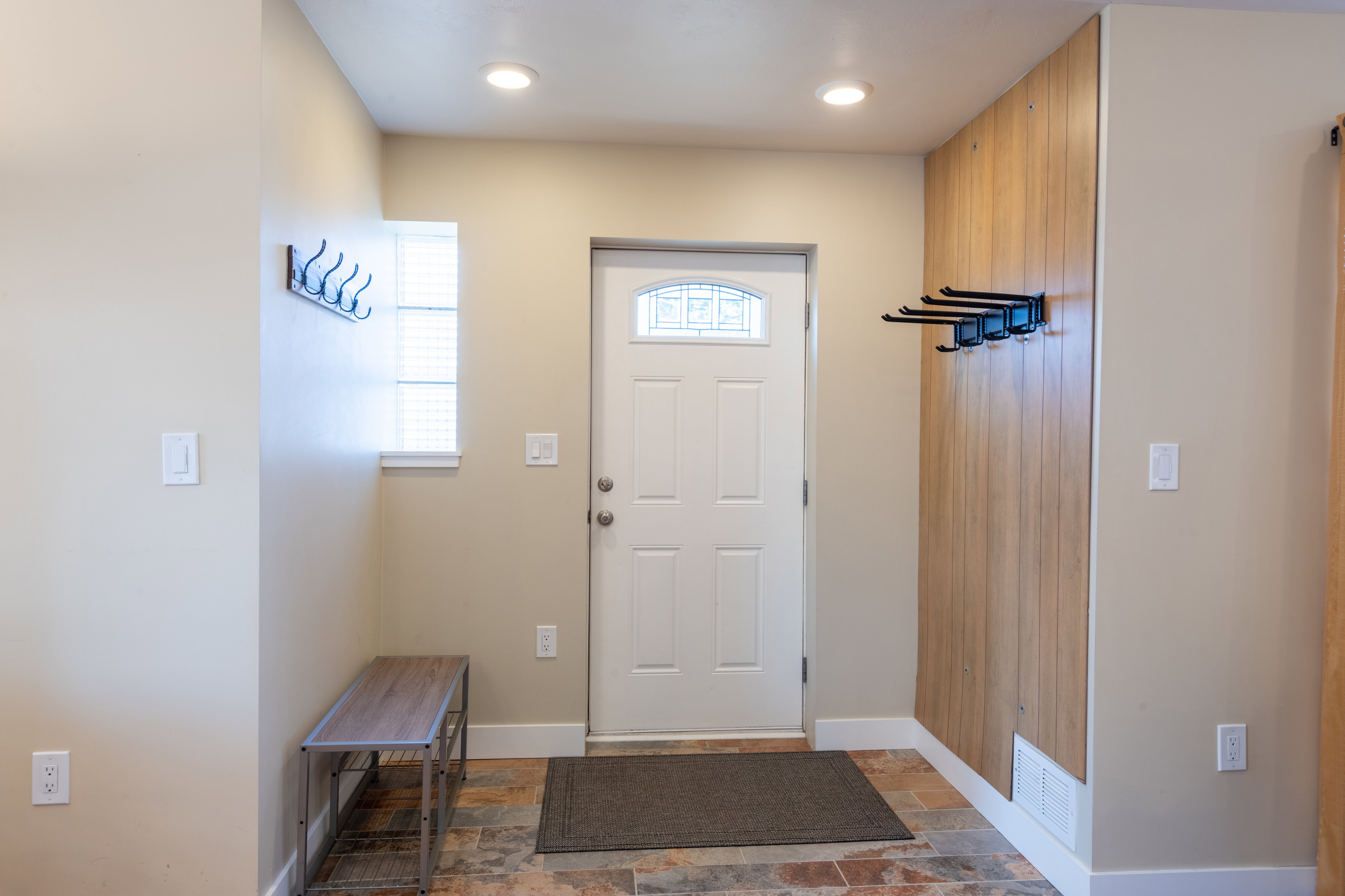 Foyer featuring stone tile floors and recessed lighting