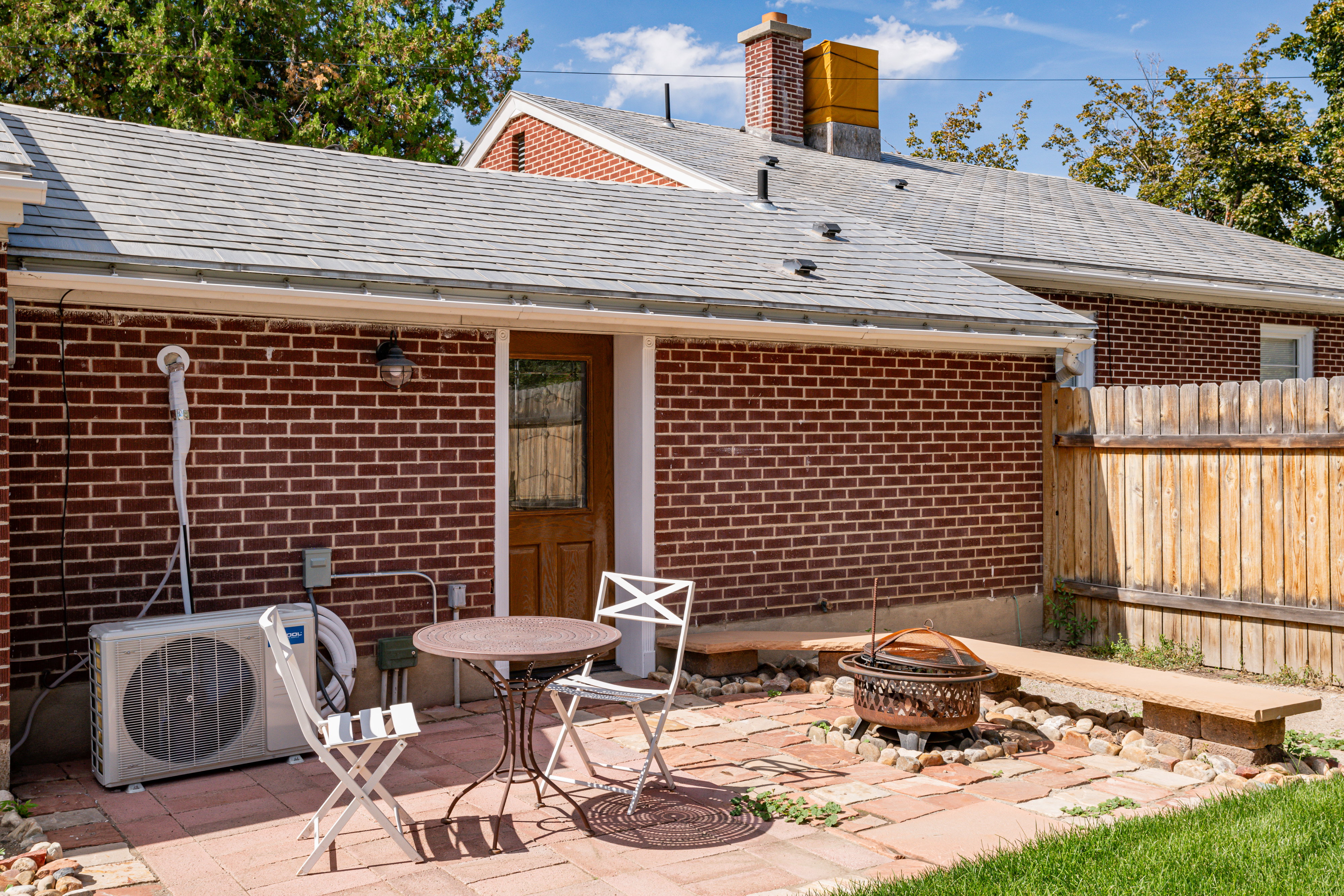 View of patio with a fire pit