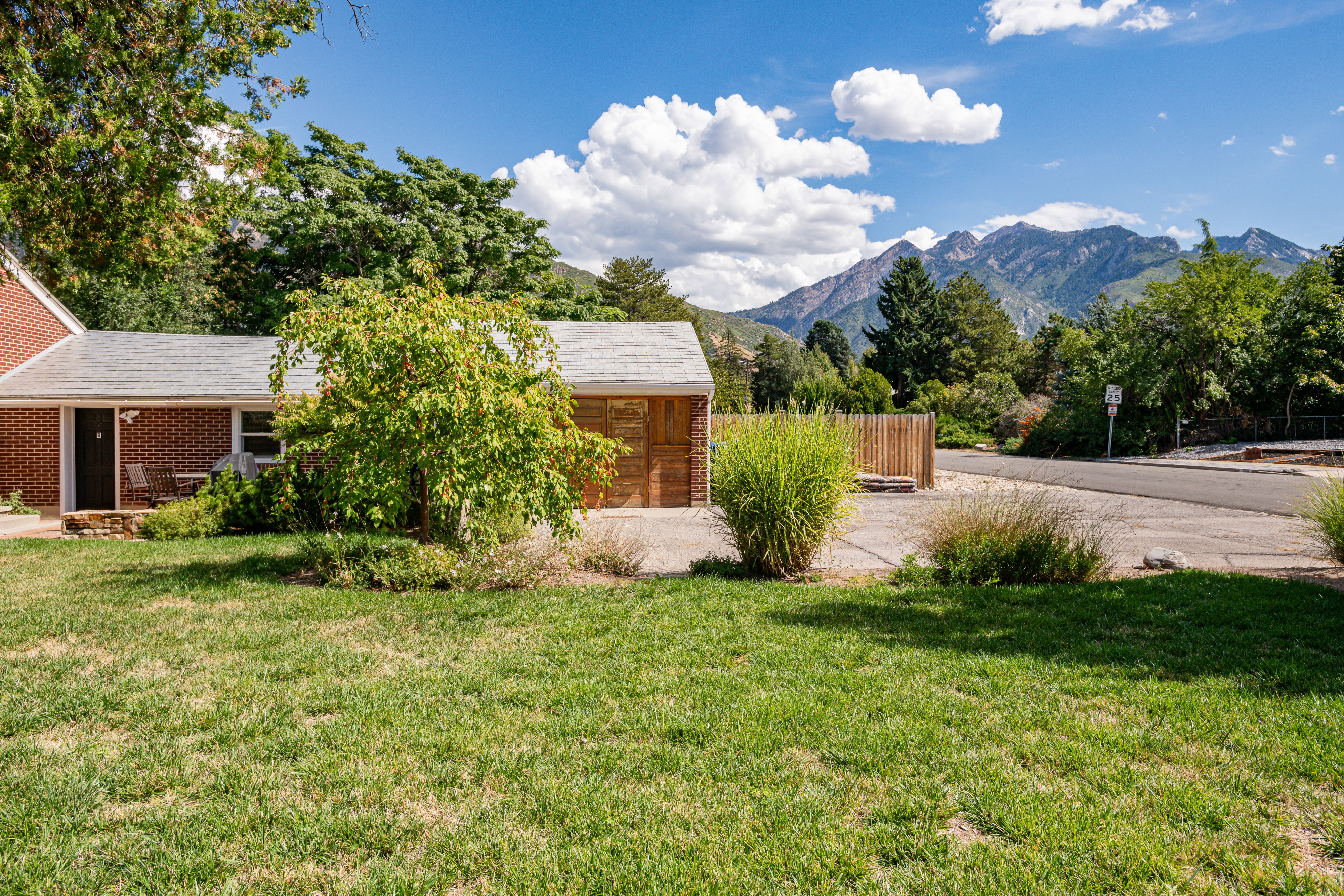 View of grassy yard featuring a mountain view