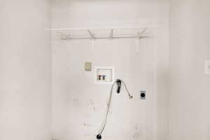 Laundry area featuring washer hookup and electric dryer hookup