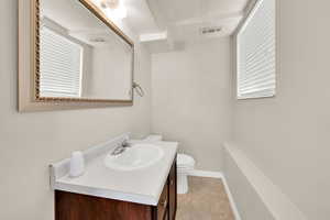Bathroom featuring vanity and light tile patterned floors
