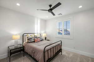 Bedroom featuring carpet flooring, ceiling fan, multiple windows, and recessed lighting