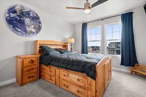 Bedroom featuring carpet flooring and a ceiling fan