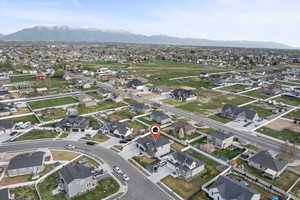 Aerial view of residential area featuring mountains