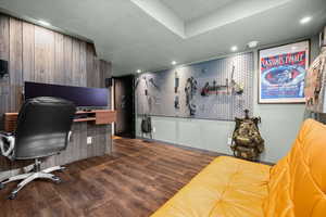 Office space with dark wood-style floors, a textured ceiling, and recessed lighting