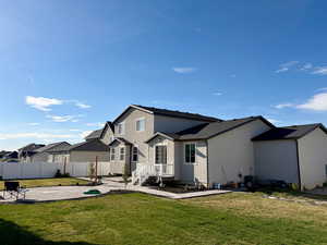 Back of property featuring a patio area, stucco siding, and a residential view
