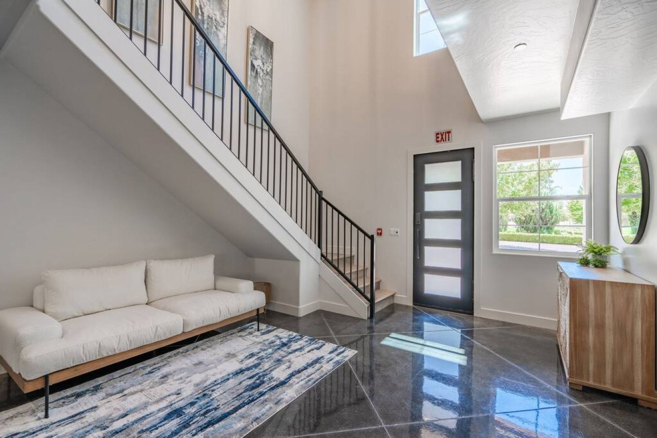 Entrance foyer with a high ceiling and granite tiled floors