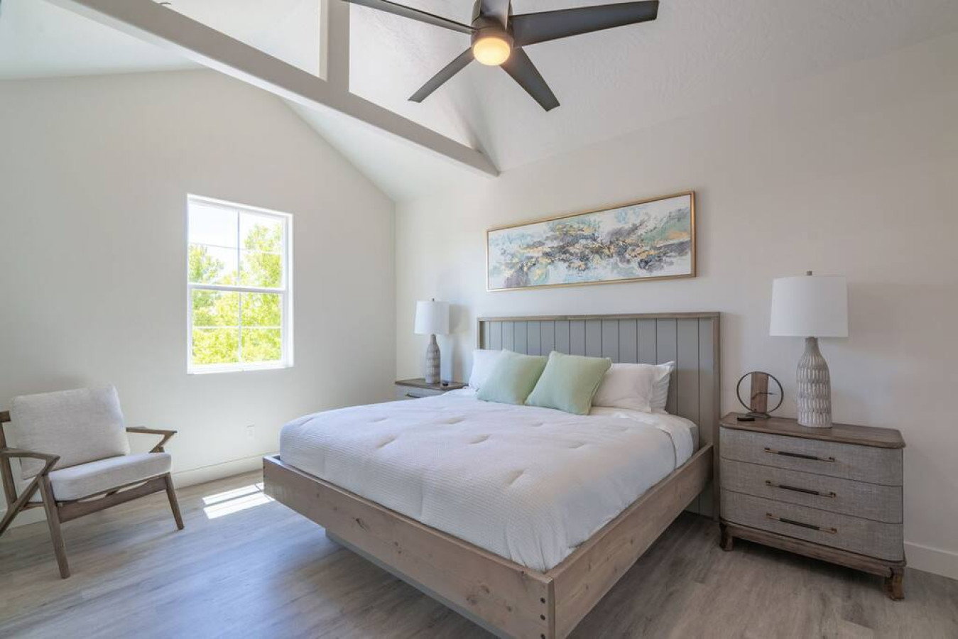 Bedroom featuring wood finished floors and ceiling fan
