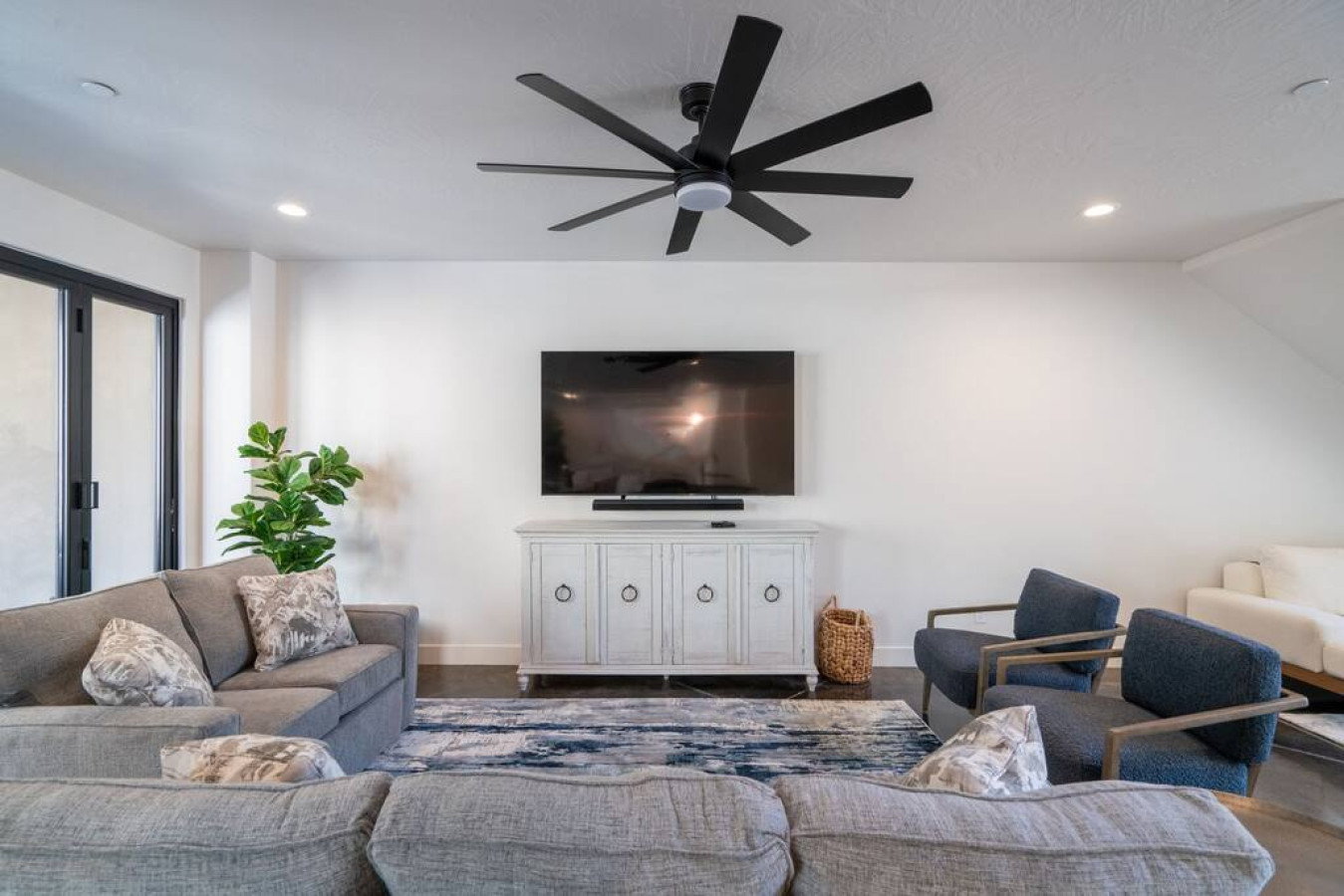 Living room featuring ceiling fan and recessed lighting