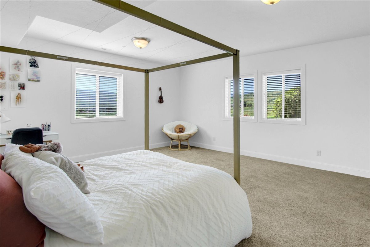 Basement South Bedroom Carpeted bedroom featuring multiple windows