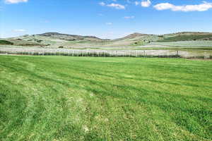 View of yard with a mountain view and a view of countryside