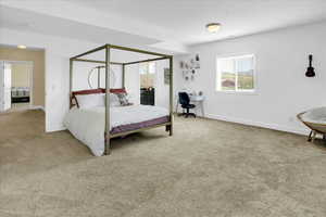 Basement South Bedroom with a desk, light carpet, and ensuite bathroom