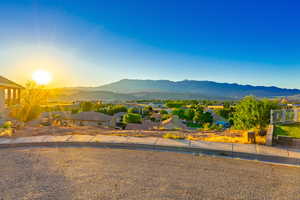 View of mountain backdrop featuring nearby suburban area