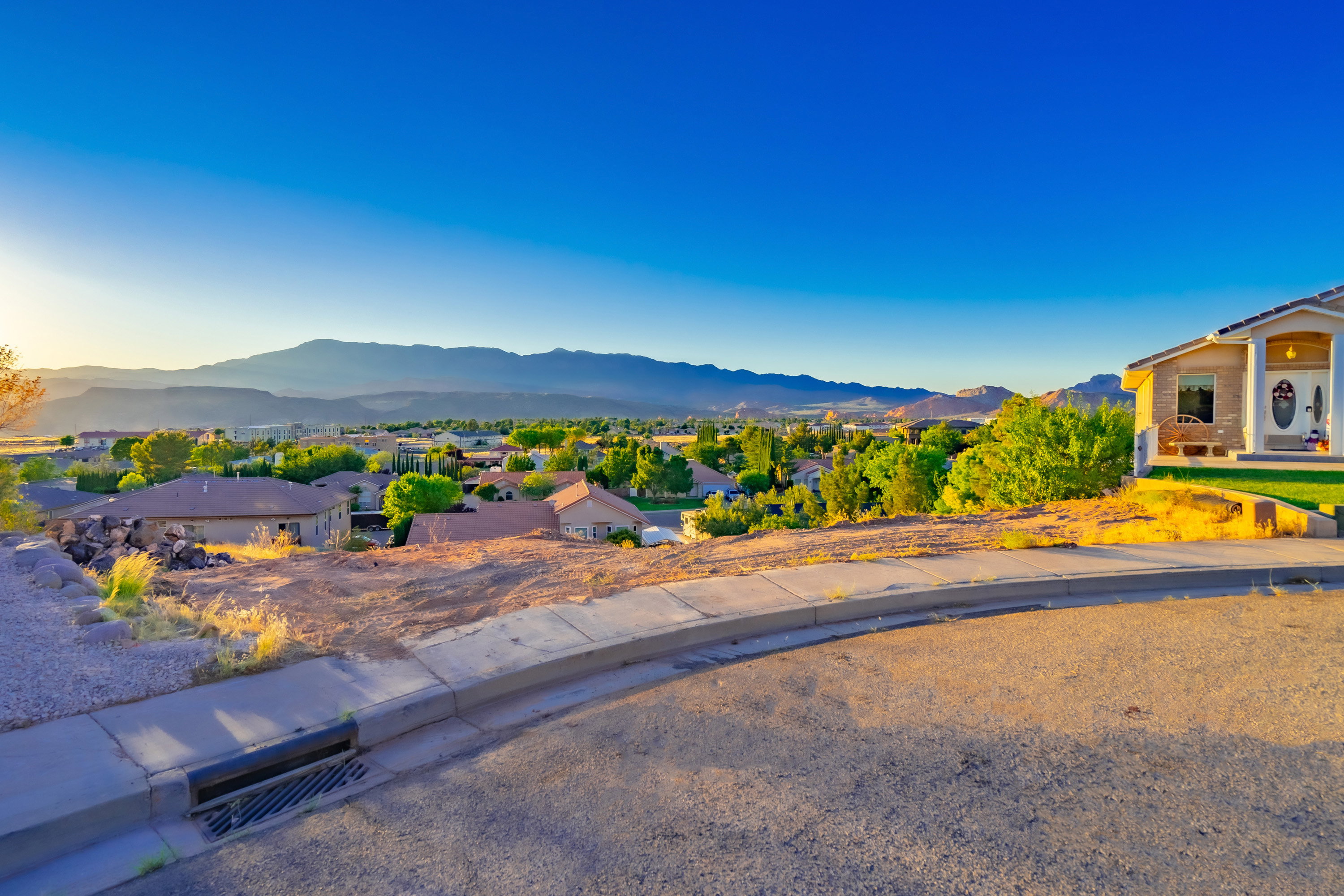 View of mountain background featuring nearby suburban area