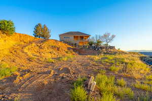 View of yard featuring a mountain view and a balcony