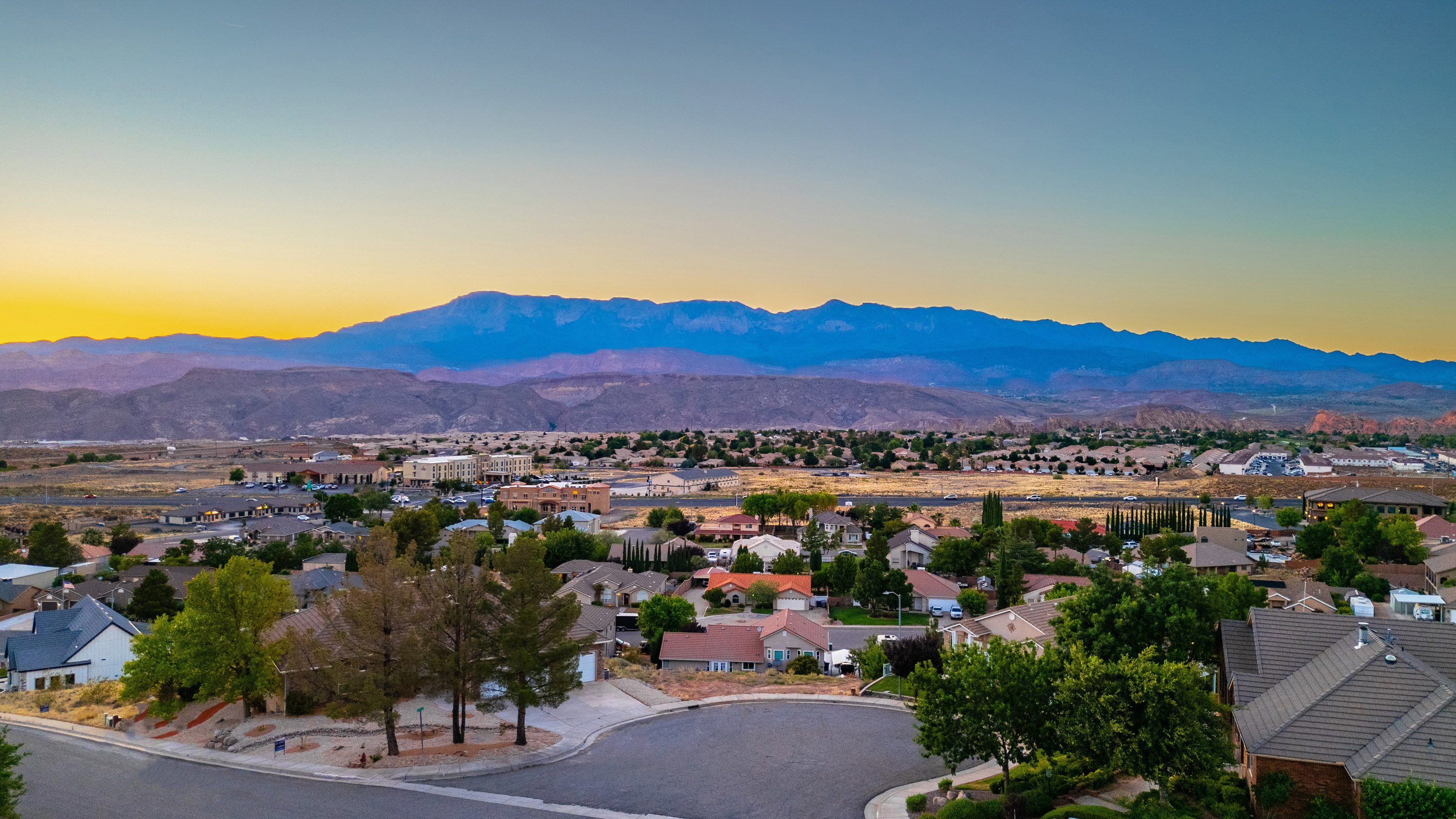 Mountain view featuring nearby suburban area