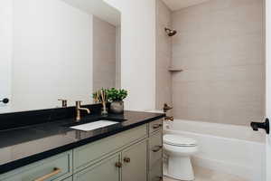 Bathroom featuring vanity and tub / shower combination