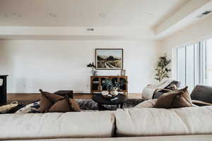 Living room featuring wood finished floors and recessed lighting