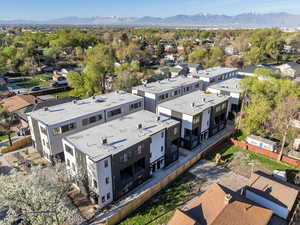 Aerial view of residential area featuring mountains