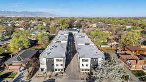 Aerial perspective of suburban area with a mountain backdrop