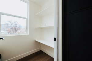 Detailed view of wood finished floors and built in study area