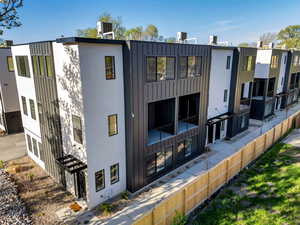 Rear view of property with board and batten siding
