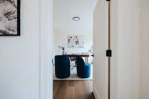 Hallway featuring light wood finished floors