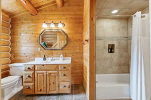 Full bathroom with vanity, shower / bath combo with shower curtain, wooden ceiling, and recessed lighting