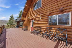 Deck with area for grilling and a mountain view
