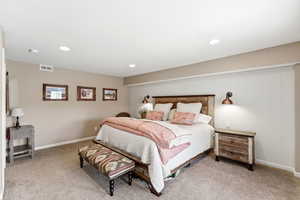 Bedroom featuring light colored carpet and recessed lighting