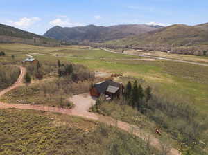 View of mountain background featuring rural landscape