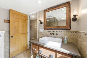 Bathroom featuring vanity and recessed lighting