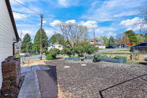 View of yard with a garden and a residential view