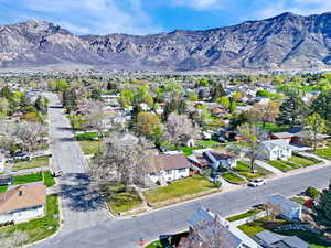 Aerial perspective of suburban area featuring a mountain backdrop