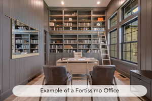 Office with wooden walls, built in shelves, and wood finished floors