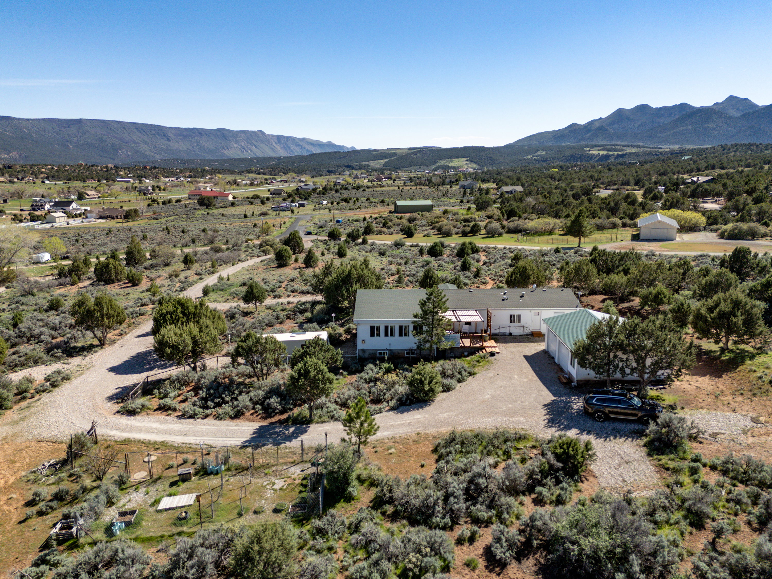 Overview of rural landscape featuring a mountainous background