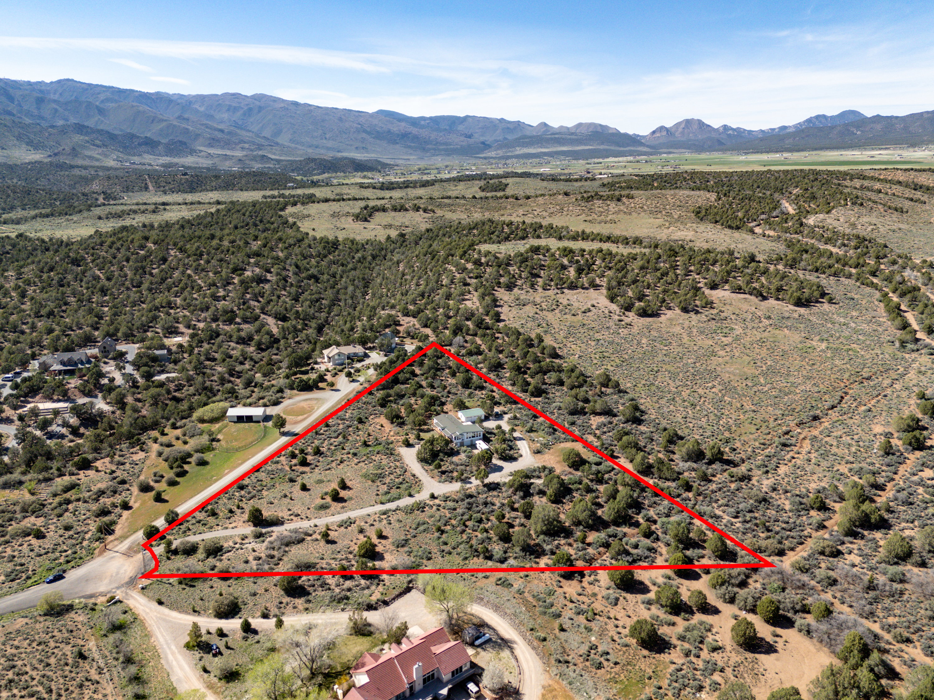 View of rural area featuring property boundaries highlighted and a mountain backdrop