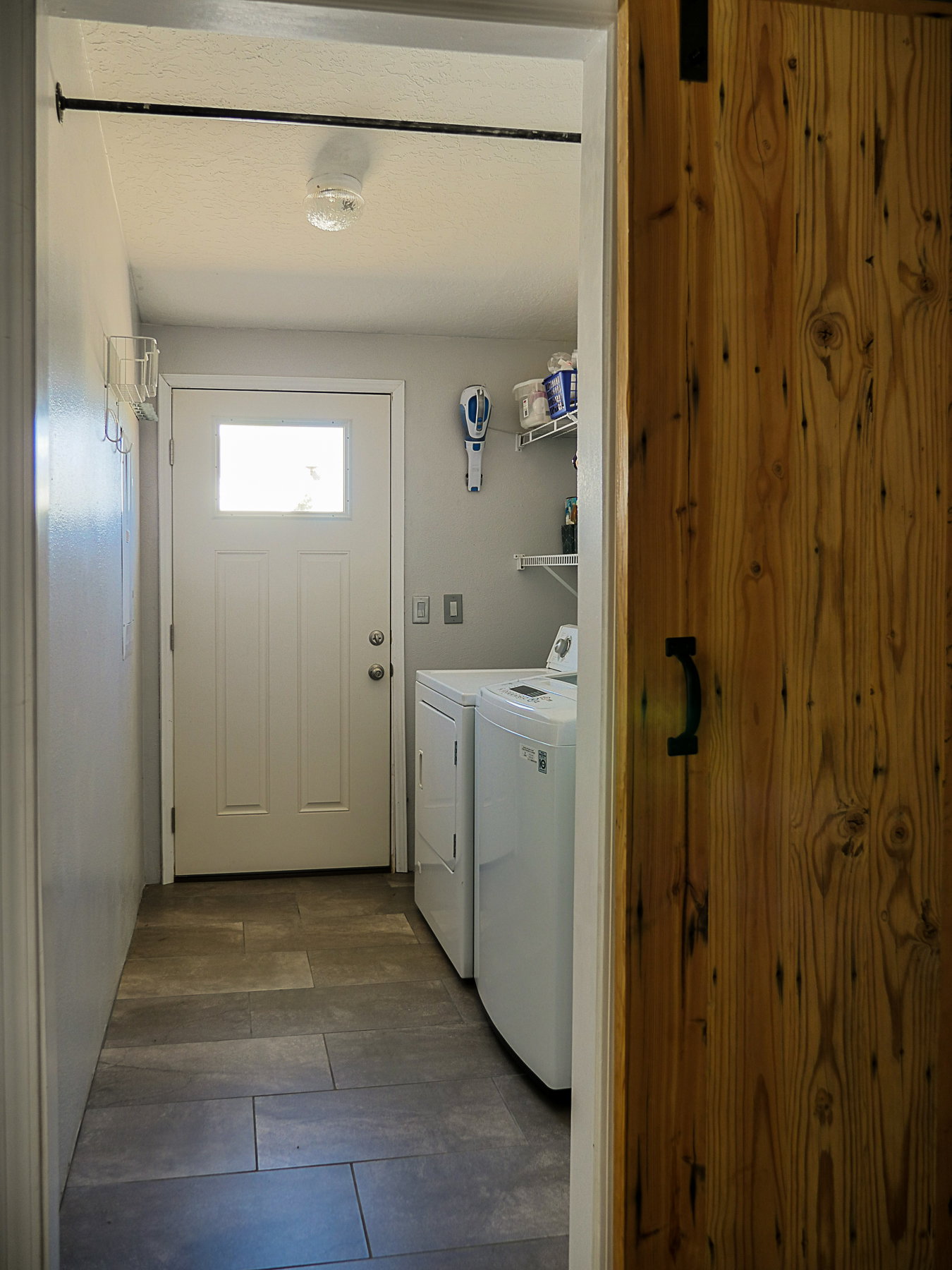 Laundry room featuring washing machine and clothes dryer