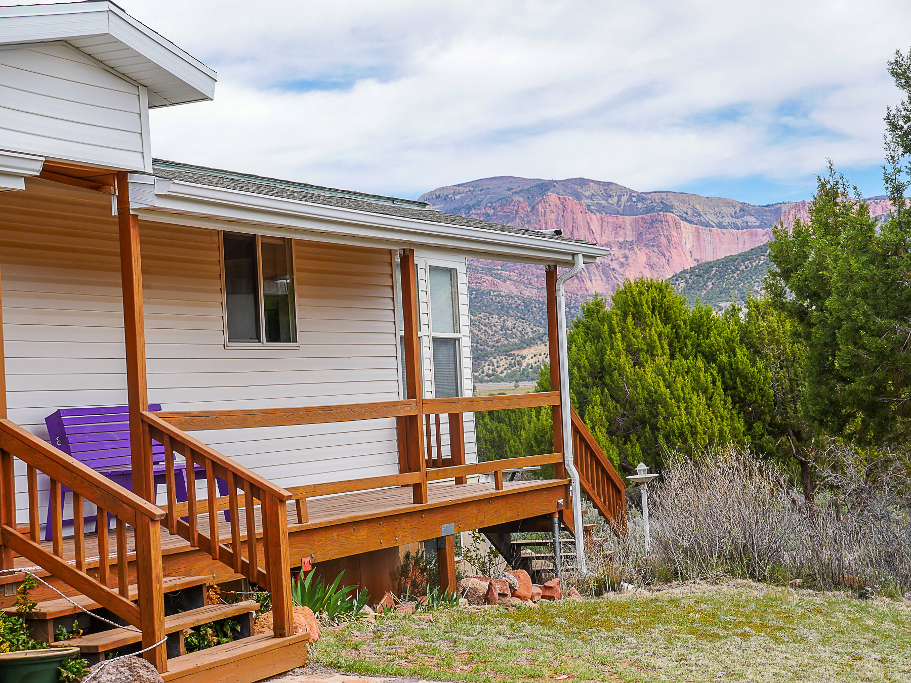 Wooden terrace with stairway and a mountain view