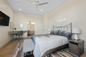 Bedroom with ceiling fan, ensuite bathroom, and recessed lighting