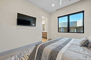 Bedroom featuring connected bathroom, ceiling fan, and recessed lighting