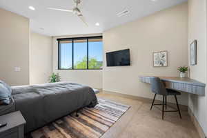 Bedroom with concrete floors, recessed lighting, and ceiling fan