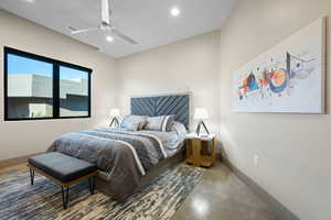 Bedroom with concrete floors, a ceiling fan, and recessed lighting