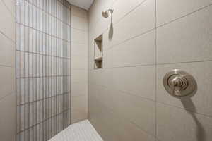 Full bath with a tile shower