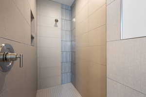 Bathroom featuring tiled shower