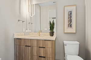 Half bath with toilet and vanity