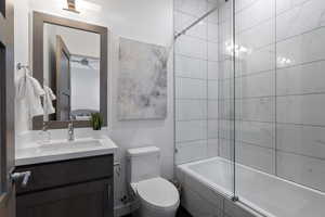 Bathroom featuring vanity and tiled shower / bath combo