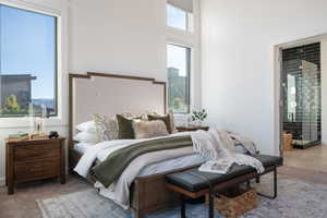 Carpeted bedroom featuring connected bathroom