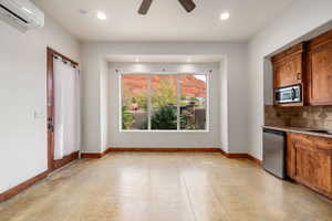 Kitchen with wood finish cabinets, a ceiling fan, light stone counters, finished concrete flooring, and recessed lighting